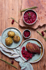 French cuisine roast duck with cherry sauce in a blue plate