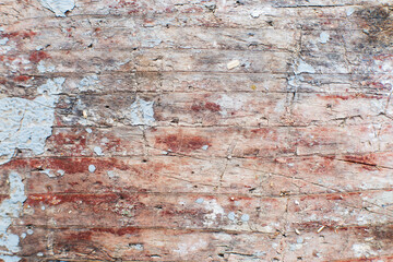 Old shabby wooden planks background with cracked color paint.