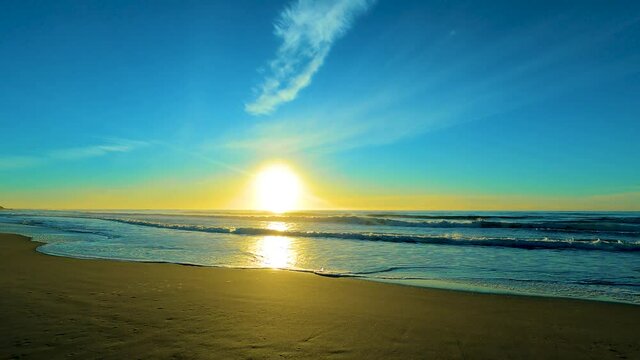Sun is falling down in the sea, beautiful beach view
