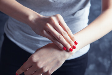 a young girl has a sore wrist