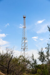 telecommunications and relay tower in the distance from residential buildings