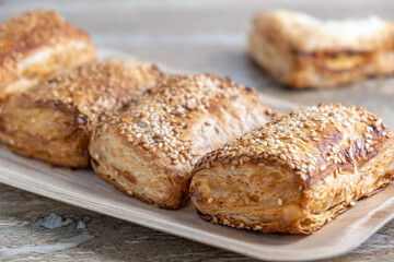 Potato Burekas on wooden background. Israeli Savory Potato Pastries.