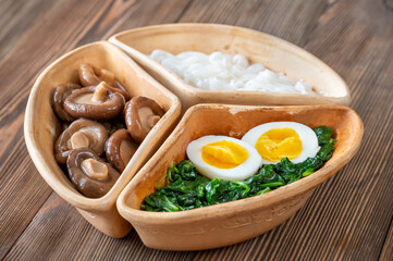 Bowl with rice noodles, mushrooms and spinach