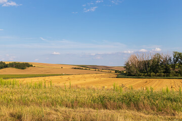 Beautiful wavy landscape of Moravian Tuscany in the Czech Republic. Blue sky and clouds.
