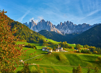 Famous best alpine place of the world, Santa Maddalena village with magical Dolomites mountains in background, Val di Funes valley