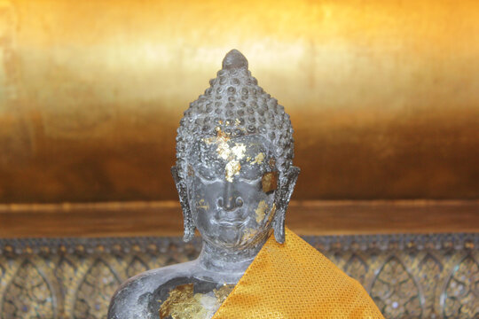 buddha statue with gold plates on the face buddha in thailand