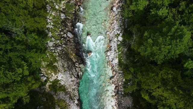 Soca Alpine Mountains River in Slovenia. Aerial View Drone Top Down in Real Time