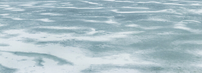 Texture of snow-covered ice on the river after a blizzard. Winter background