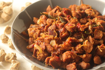 Dry roasted soya chunks with onions tomatoes and spices. Prepared with Kerala style meat masala in coconut oil