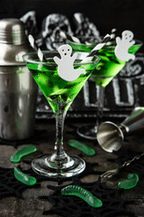Green witch drink  in glass with ghost, Halloween party  idea