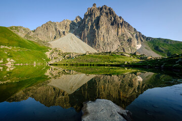 Obraz premium Midi d'Ossau peak, 2884 meters, and Pombie lake, Pyrenees National Park, Pyrenees Atlantiques, France