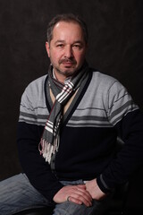 portrait of a man, various poses, looking at the camera, black background, pavilion, half-length portrait