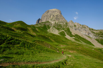 hikers descending into the valley, Col de Souzon, Midi d'Ossau peak, 2884 meters, Pyrenees National...