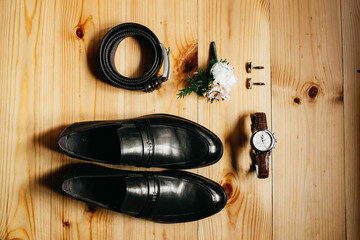 Wedding rings, a composition of the groom's accessories