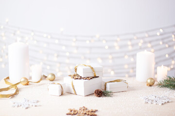 Christmas decorations with gifts on white background. Close up, copy space