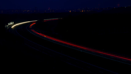 Night road lights. Lights of moving cars at night. long exposure multicolored