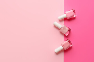 Bottles of nail polishes on color background