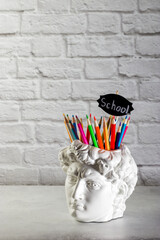 Chalk lettering School. Fashionable concept. David's head plaster stand for office, creative and...