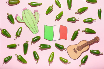 Green jalapeno peppers and drawn symbols of Mexico on color background