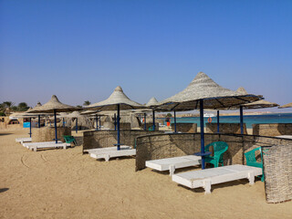 View on great sandy beach in Marsa Alam ,Egypt with umbrellas and sun loungers