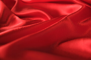 abstract texture of draped red velvet background. eautiful textile backdrop. Close-up. Top view