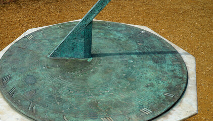 Sundial with Copper Oxide Surface shadow showing time.