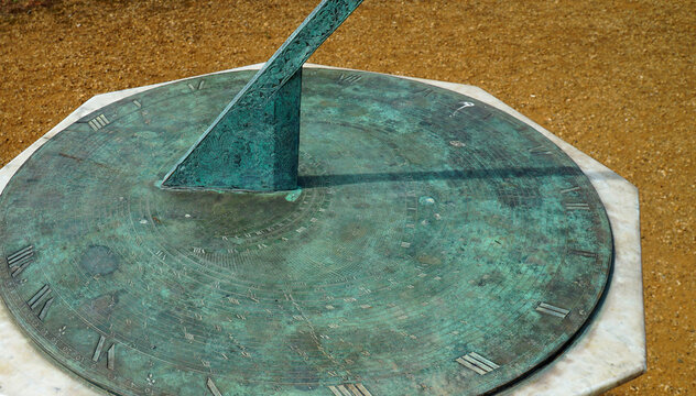 Sundial With Copper Oxide Surface Shadow Showing Time.