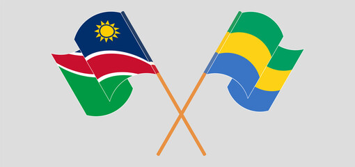 Crossed and waving flags of Namibia and Gabon