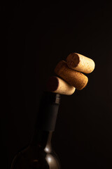 Three wine corks on the wine bottleneck. 