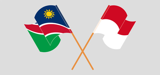 Crossed and waving flags of Namibia and Monaco