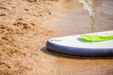 Background with paddle board, sup on a sand