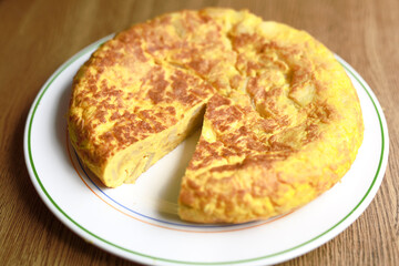 Homemade Spanish omelette on a white plate.