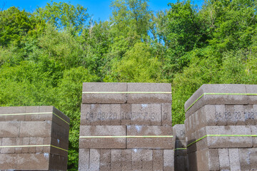 Stacks of grey concrete  blocks on a building site