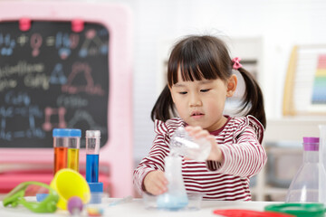 young girl playing Science experiment toys for homeschooling