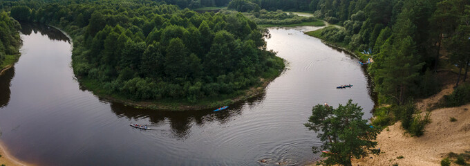 Aerial top view river, forest and beach. Gorgeous aerial panoramic view on the touristic part of the river Berezina in Belarus.