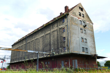 Old abandoned warehouse at an inland port (Midland Canal) that has not been in use for years. Lost places in Hanover, Lower Saxony, Germany.