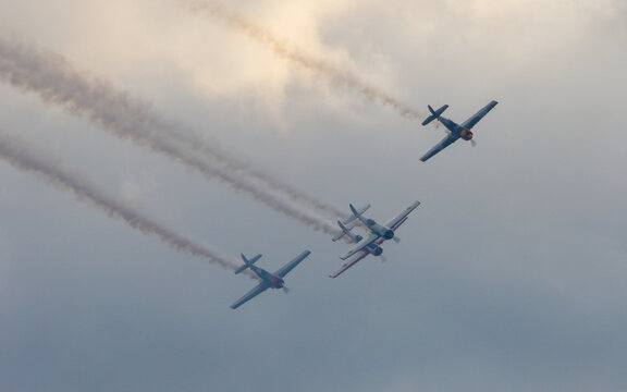 Airplanes In Formation Trailing Smoke