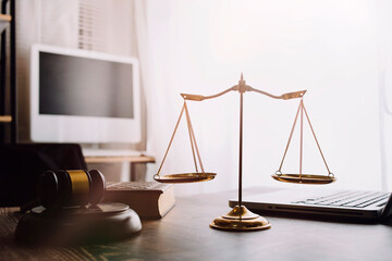 Business and lawyers discussing contract papers with brass scale on desk in office. Law, legal...