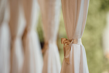 white and gold curtains in wedding venue, selective focus