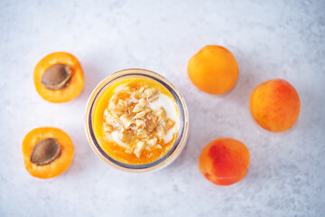 Fototapeta na wymiar Greek yogurt apricot healthy breakfast in a jar