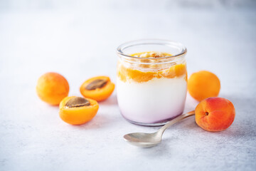 Greek yogurt apricot healthy breakfast in a jar