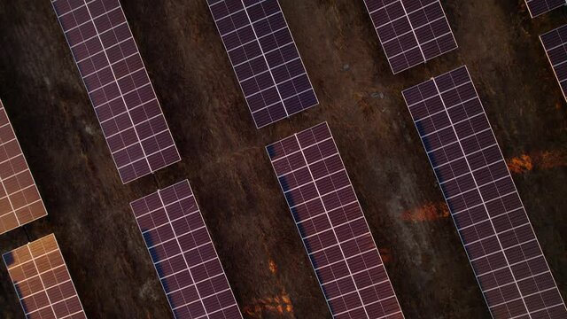 Massive solar plant at sunset. Hundreds of moving solar panels to provide clean energy. Talasol. Drone going forwards and tilting up, revealing the solar plant.