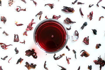 Cup of dry hibiscus and petals tea. top view © Marco Tulio
