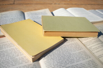 Obraz premium Open books on a wooden background