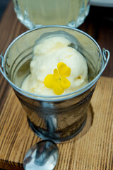 Portion of ice cream in a glass in the form of a small bucket.
