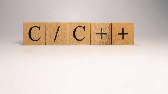 The C plus code chain is built from wooden cubes. Industry and technology. c
