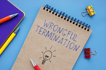 Business concept meaning Wrongful Termination with phrase on the piece of paper.