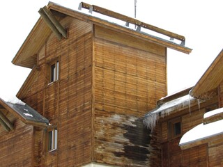 old building made by wood on mountains with snow