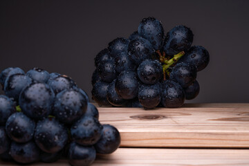 Large Grapes On A Board On A Black Background.
A variety called Nagano Purple