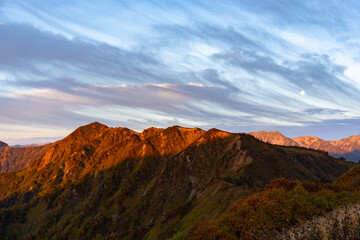 Sunset in the Hakuba mountains with moon